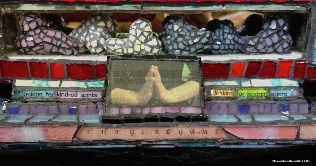 Picture of glass mosaic on wood detail hearts with text with photo of hands praying text says: the glad game/ looking for kindred spirits