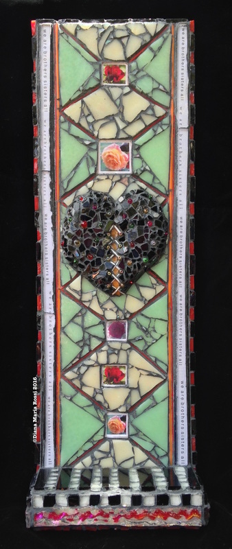 photo of glass mosaic. The mosaic features a black heart, studded with multi-colored beads. There is text lining the sides of the mosaic and it reads: we are brothers sister all. This is written in repetition. There is a diamond pattern in the background and the background is cream colored and minty green. The diamond pattern is laid out with very thin threads or rods of glass that are normally used in glass blowing. There are five photographs of roses placed throughout the diamonds. There is a floor to this mosaic, kind of like a small altar and the glass is laid in a black/white pattern on thefloor. Thank you for taking the time to experience my work.