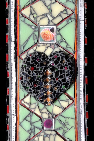photo of gladd mosaic. this is a detail of the mid section which includes the black heart studded with multi- colored beads