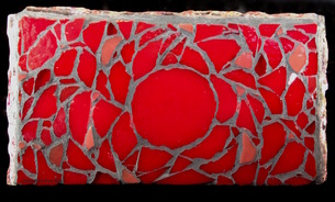 photo of underside of mosaic which is red glass in a rose pattern