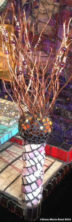glass mosaic on wood / view of light post with copper wire sprouting out of top