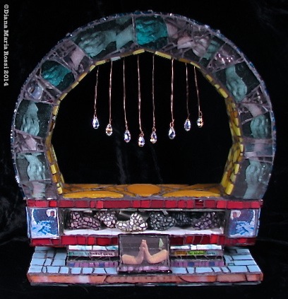 Picture of art glass mosaic on wood with prisms and photos and text photos of hands under clear glass going around in a half circle or arch Text reads: the glad game/looking for kindred spirits. there is a photo of hands clasped in prayer and hands holding a rose