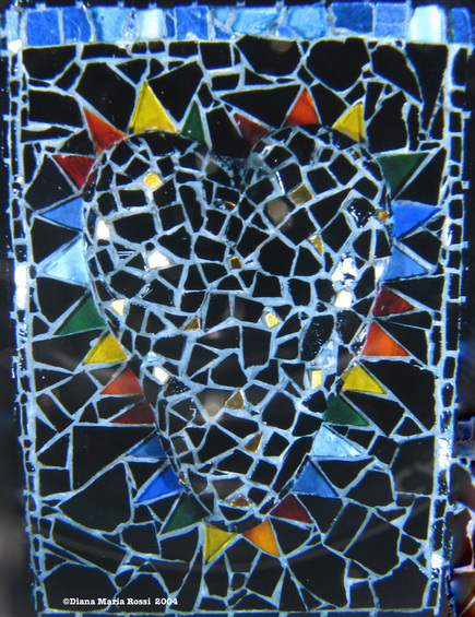 Picture of glass mosaic on wood heart black with rainbow spokes
