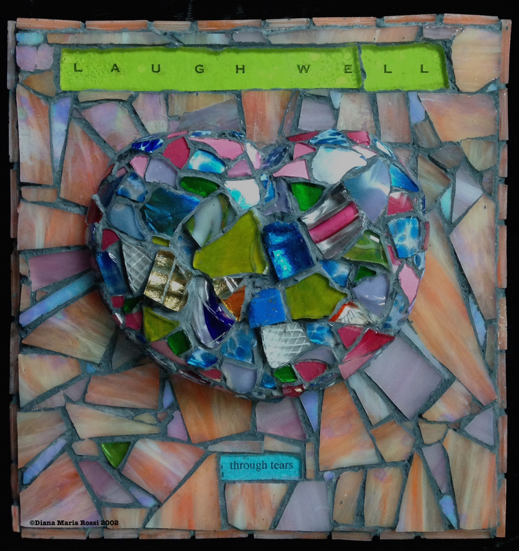 Picture of art glass mosaic on wood multi-colored heart on orangish background with text: laugh well /through tears