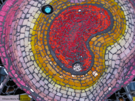 Picture of glass mosaic on wood with red kidney shaped soul  with jewel