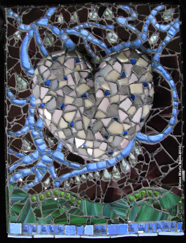 Picture of art glass mosaic on wood grey heart with tear drops and text dark brown background with green and blue on bottom