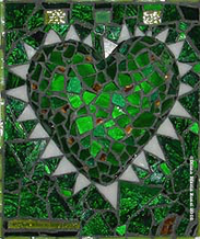 Picture of art glass mosaic on wood green heart with text know the game/but know when to stop playing
