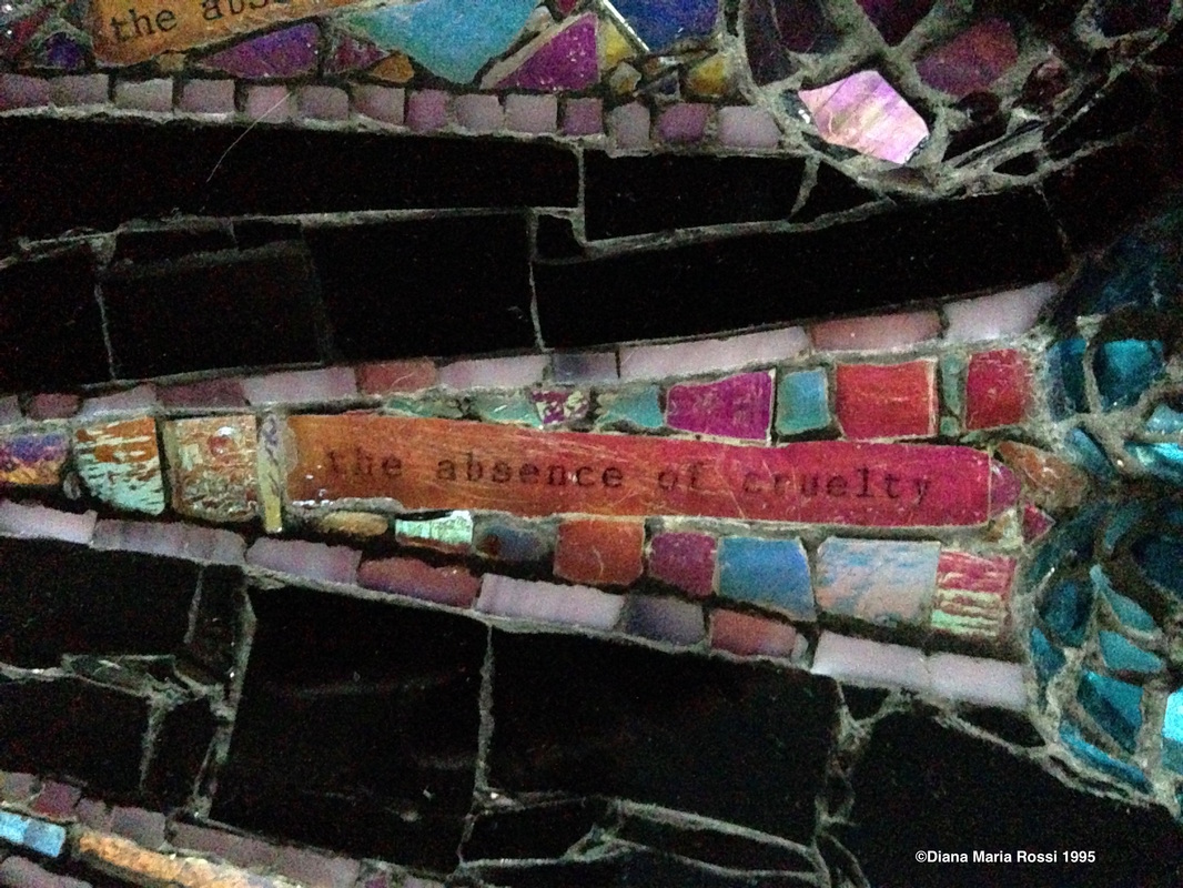 photo of detail of glass mosaic with text that reads: the absence of cruelty