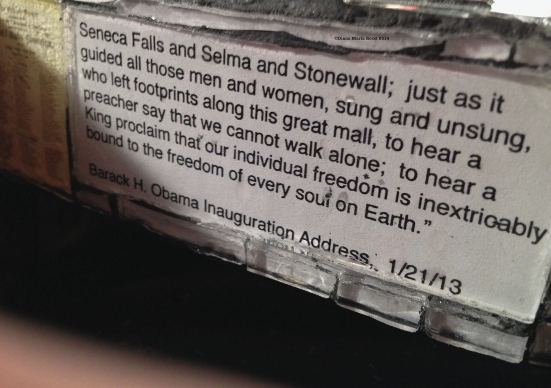 Picture of glass mosaic on wood detail with text under glass Barack Obama's 1/21/13 Inauguration Address 